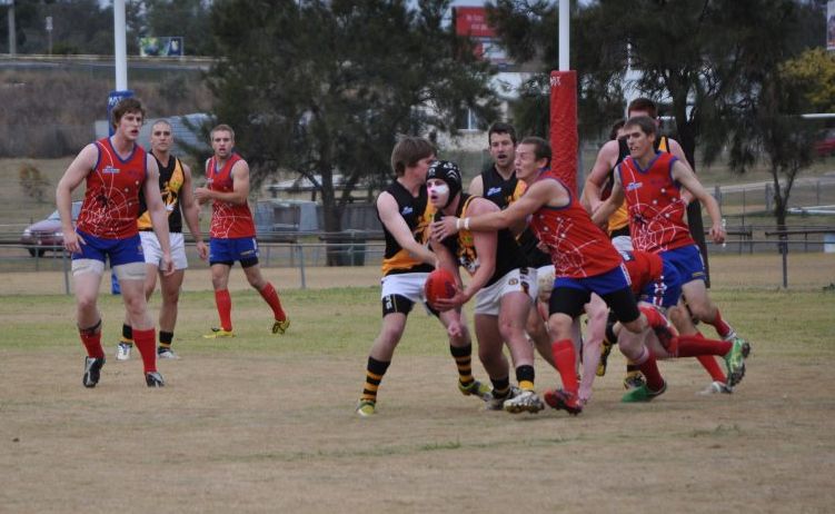 STRUGGLE: Tigers Michael Bailey and Aaron Gatfield defend team mate Luke Adams (holding ball) from Redbacks Tyhe Clarkson and Shawn Brown. STRUGGLE: Tigers Michael Bailey and Aaron Gatfield defend team mate Luke Adams (holding ball) from Redbacks Tyhe Clarkson and Shawn Brown.